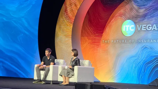 A guest and a moderator in conversation on the Main Stage in front of the ITC Vegas ring backdrop.